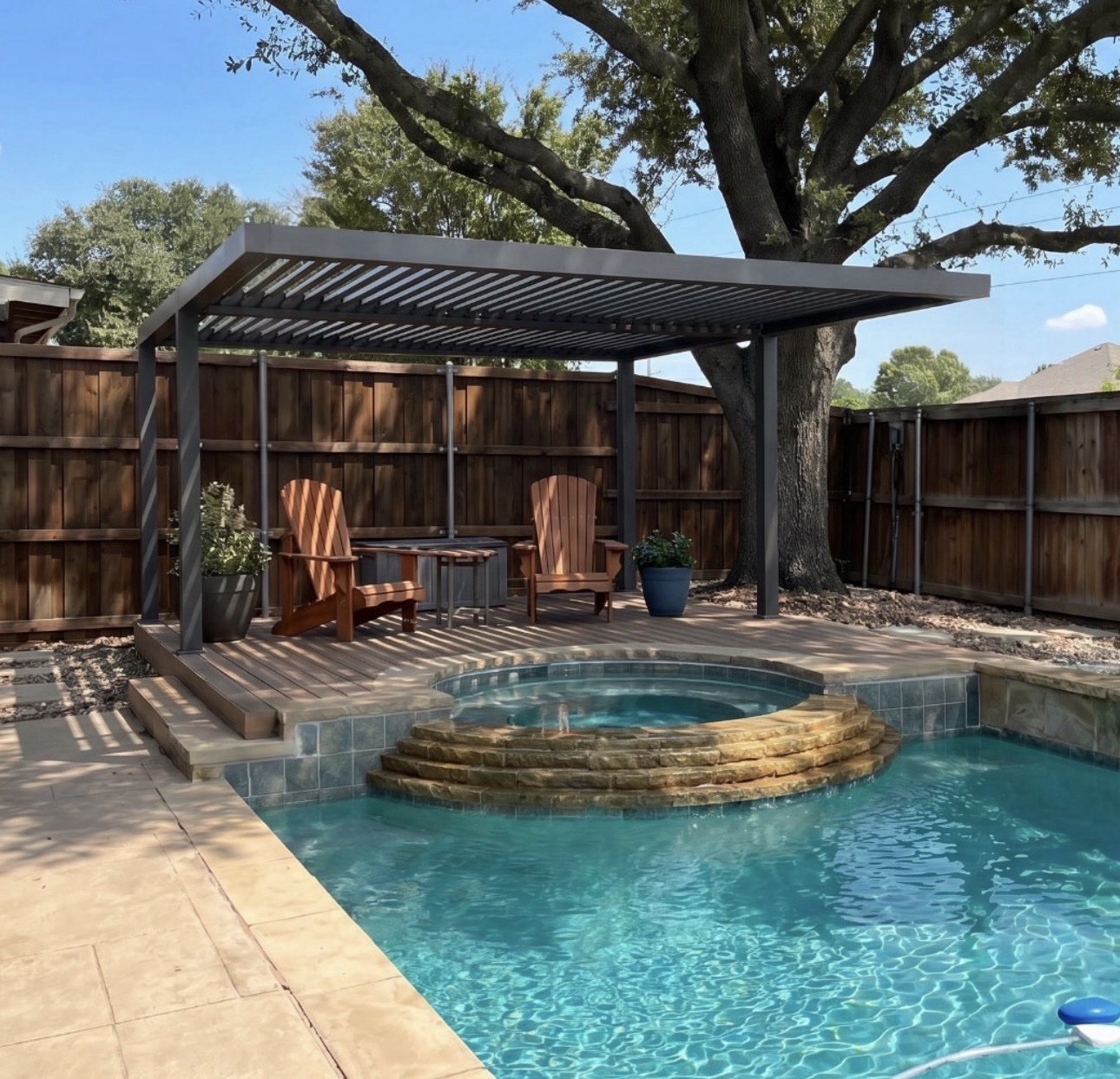 Dark charcoal motorized pergola shading a pool and spa deck in Clermont.