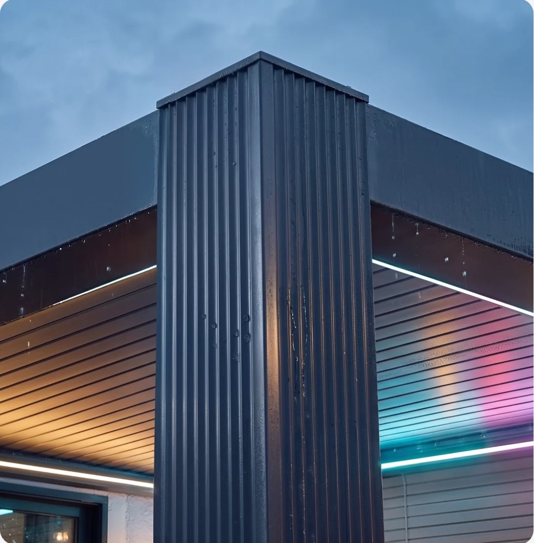 The grooved Skyy+ corner post at dusk with warm light under the roof