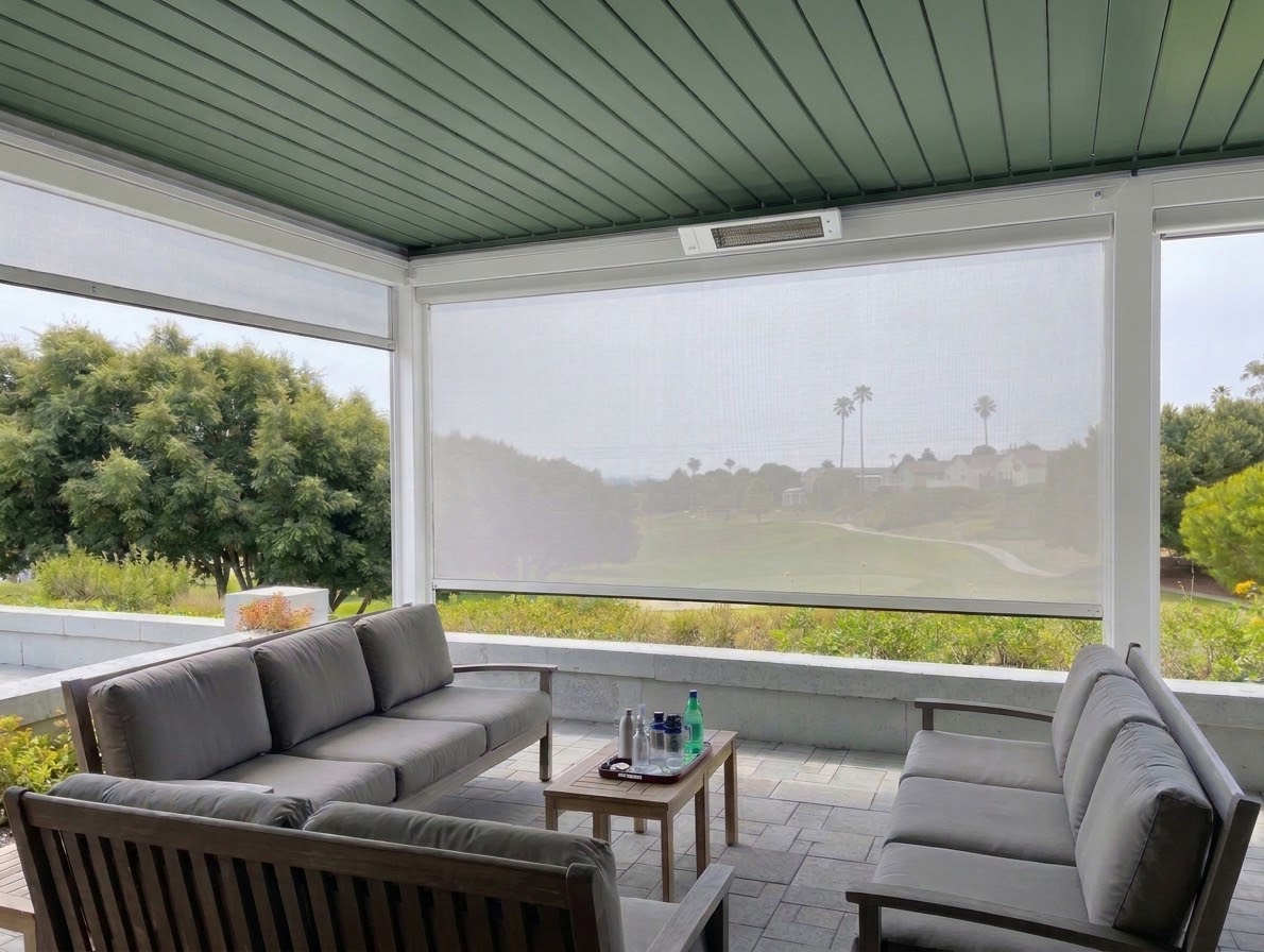 Custom pergola interior in a white frame with green louvers, motorized shade down and a heater on the beam