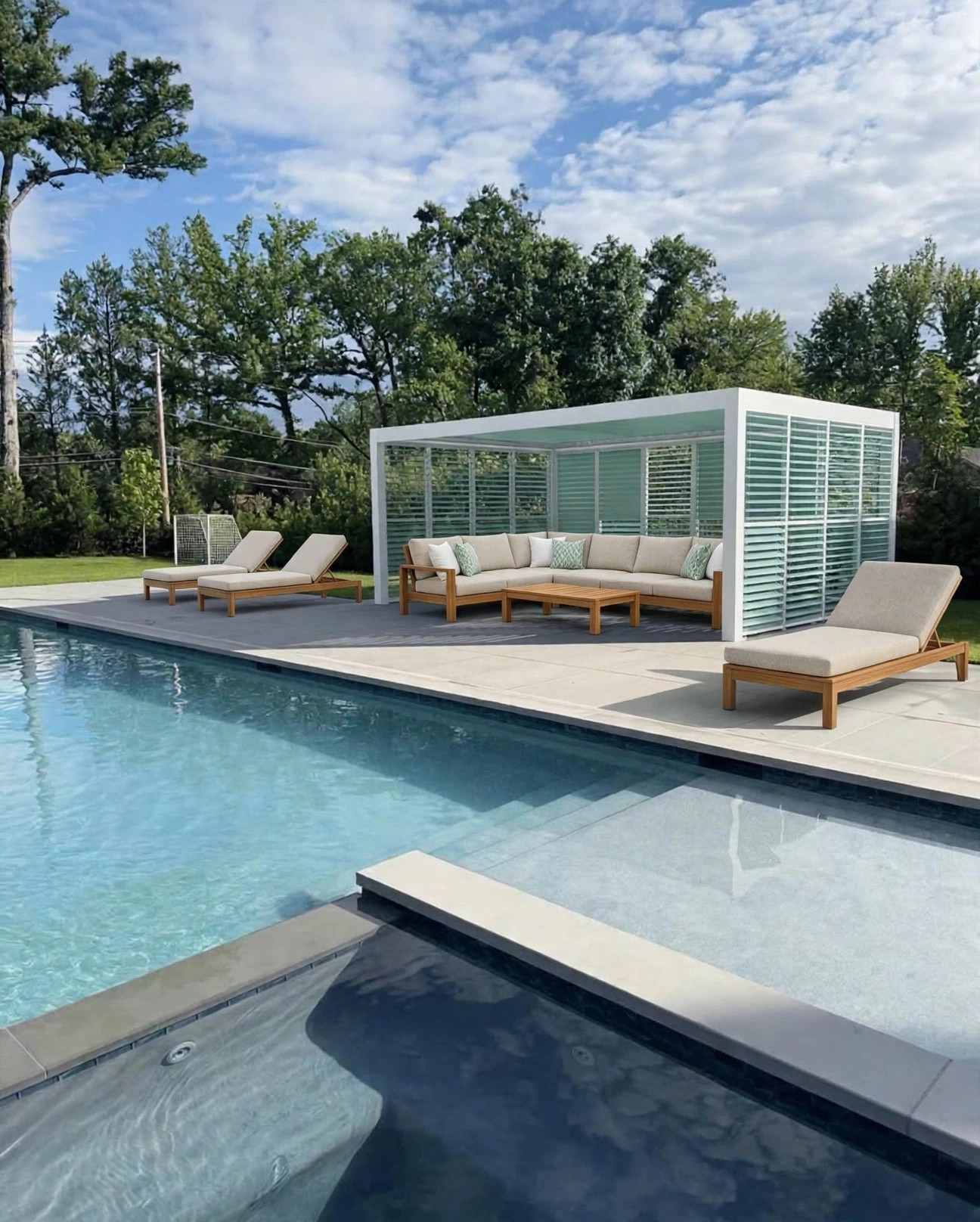 Skyy+ custom pergola in a white frame with sage louvers and shutter walls beside a pool